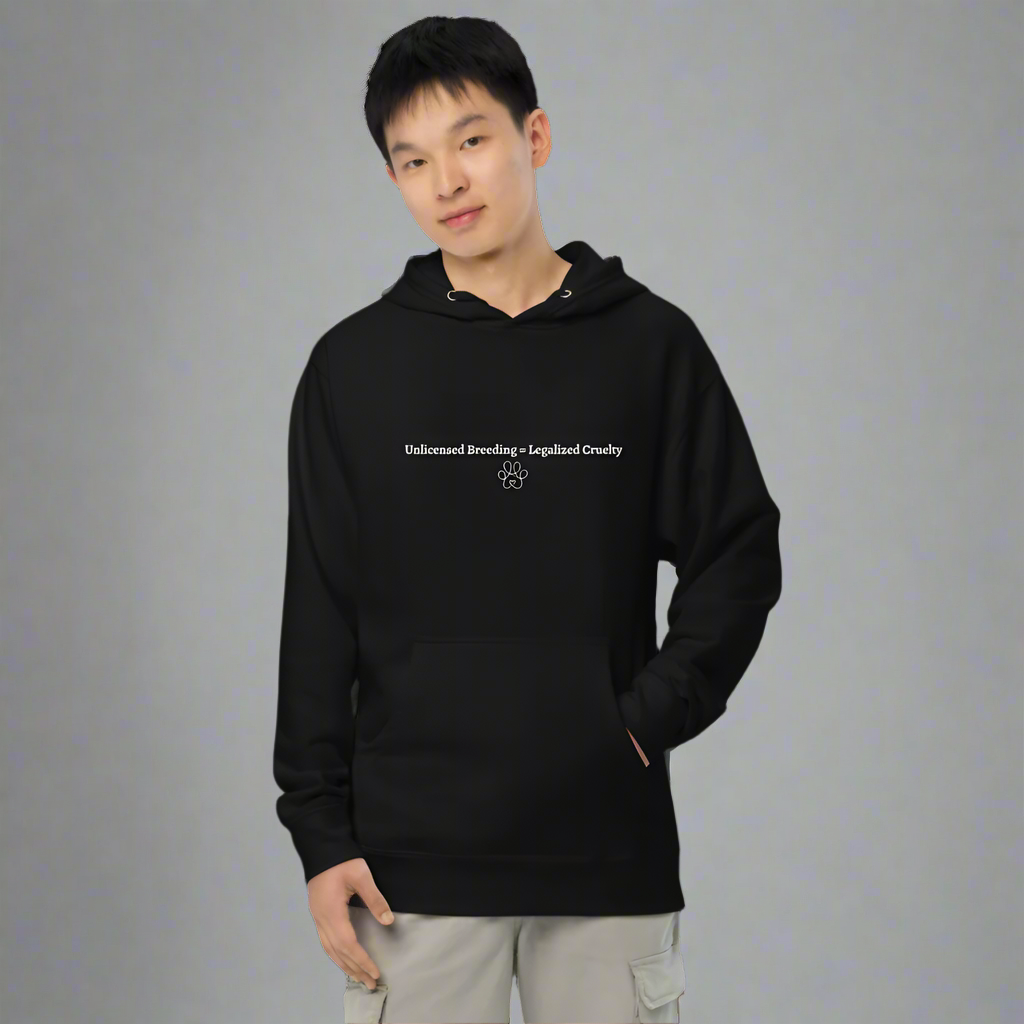 Person wearing a black hoodie with text and paw print design on a white background