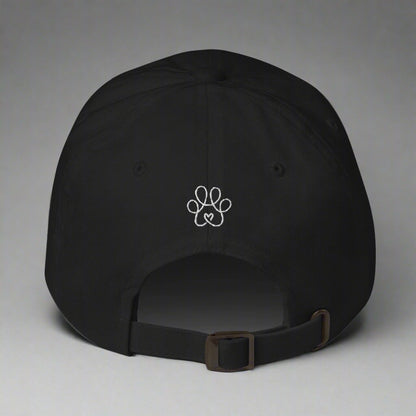 Black cap with a white paw print design on a gray background