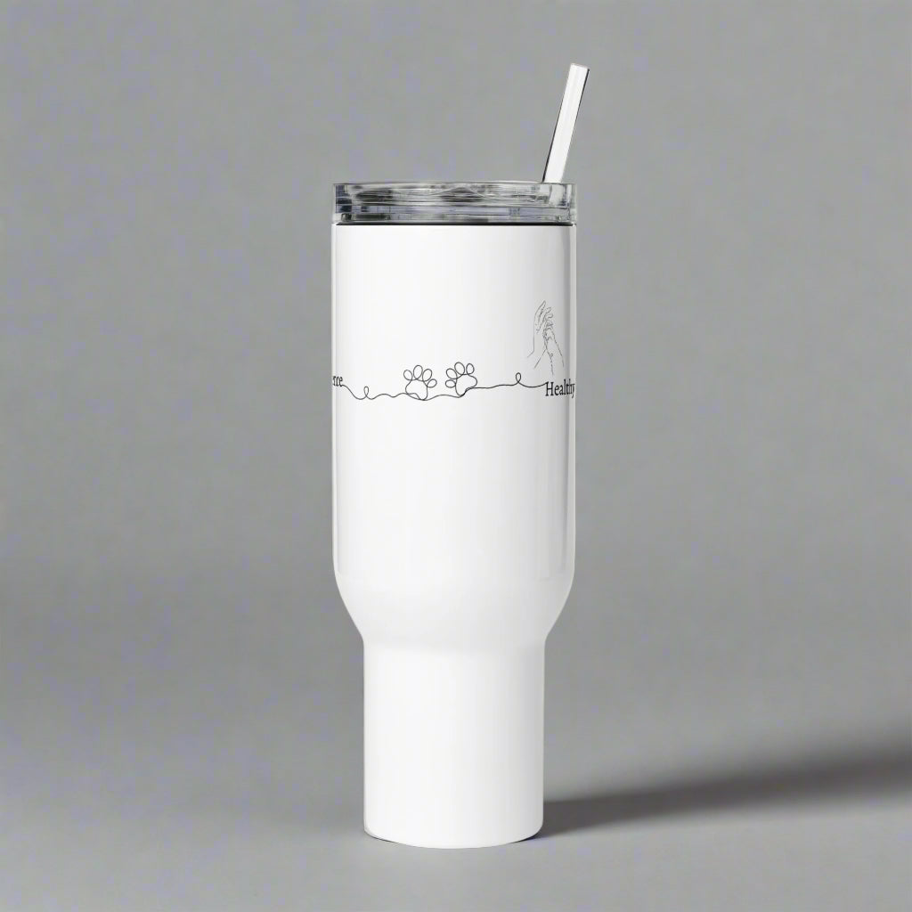 White tumbler with a straw on a gray background