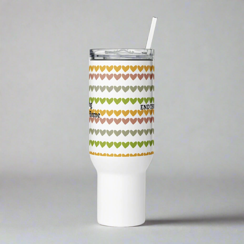 Tumbler with heart pattern and text on a gray background