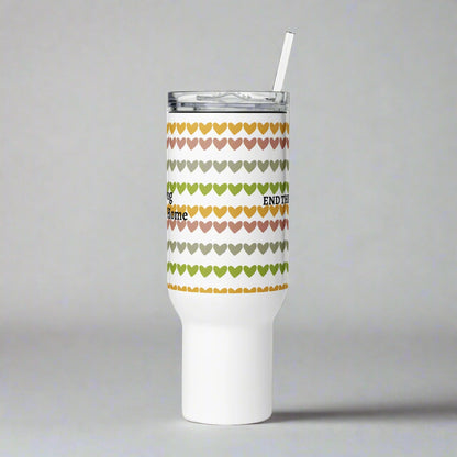 Tumbler with heart pattern and text on a gray background