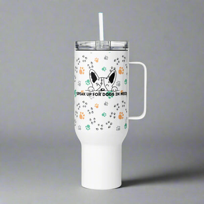 White tumbler with a handle and straw featuring paw prints and a dog graphic on a gray background