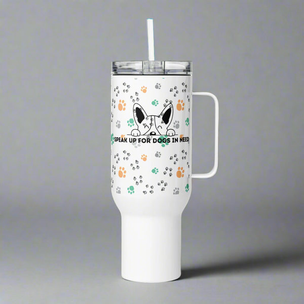 White tumbler with a handle and straw featuring paw prints and a dog graphic on a gray background