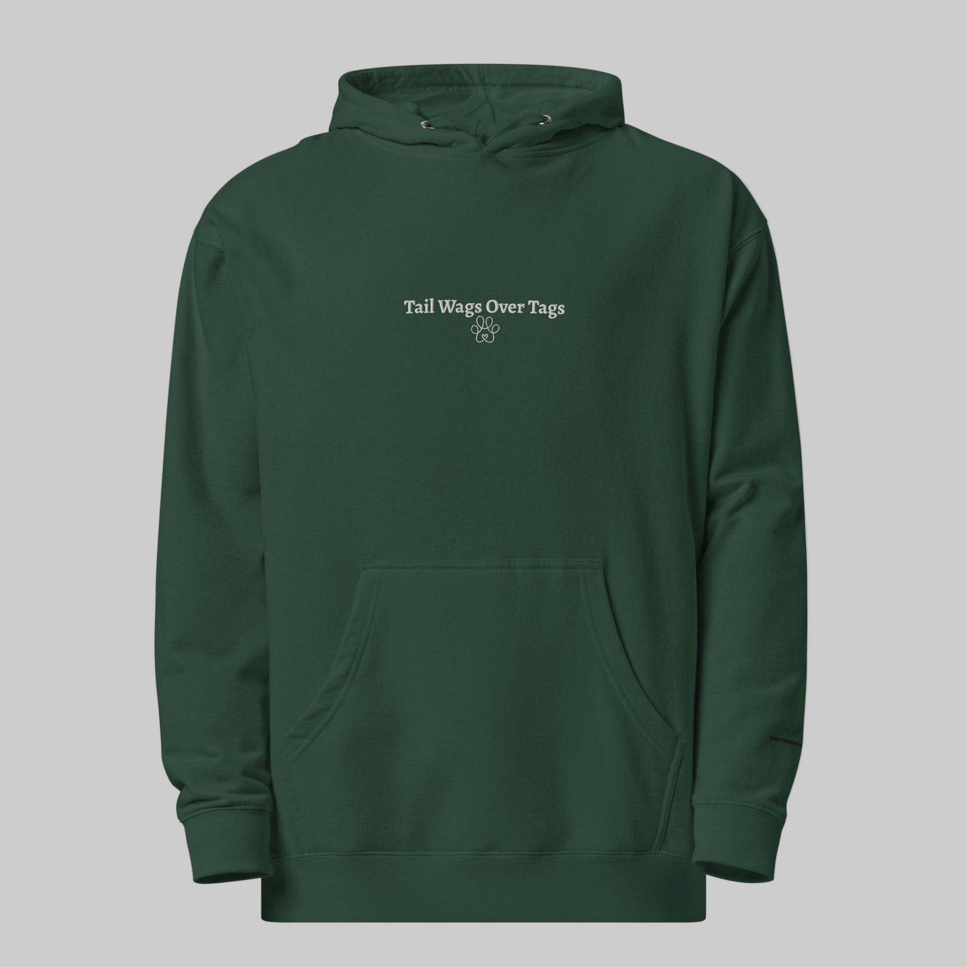 Green hoodie with 'Tail Wags Over Tags' text on a white background