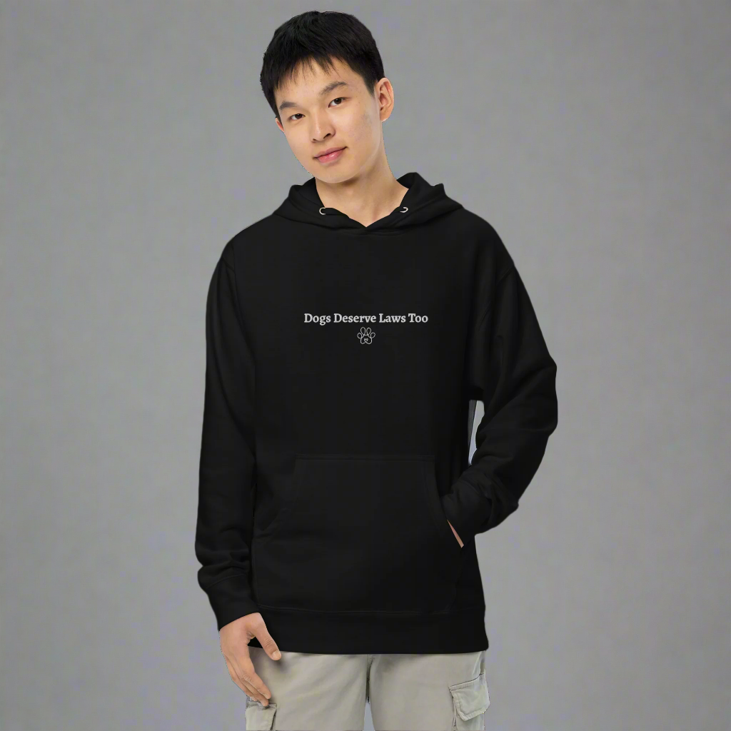 Person wearing a black hoodie with text on a white background