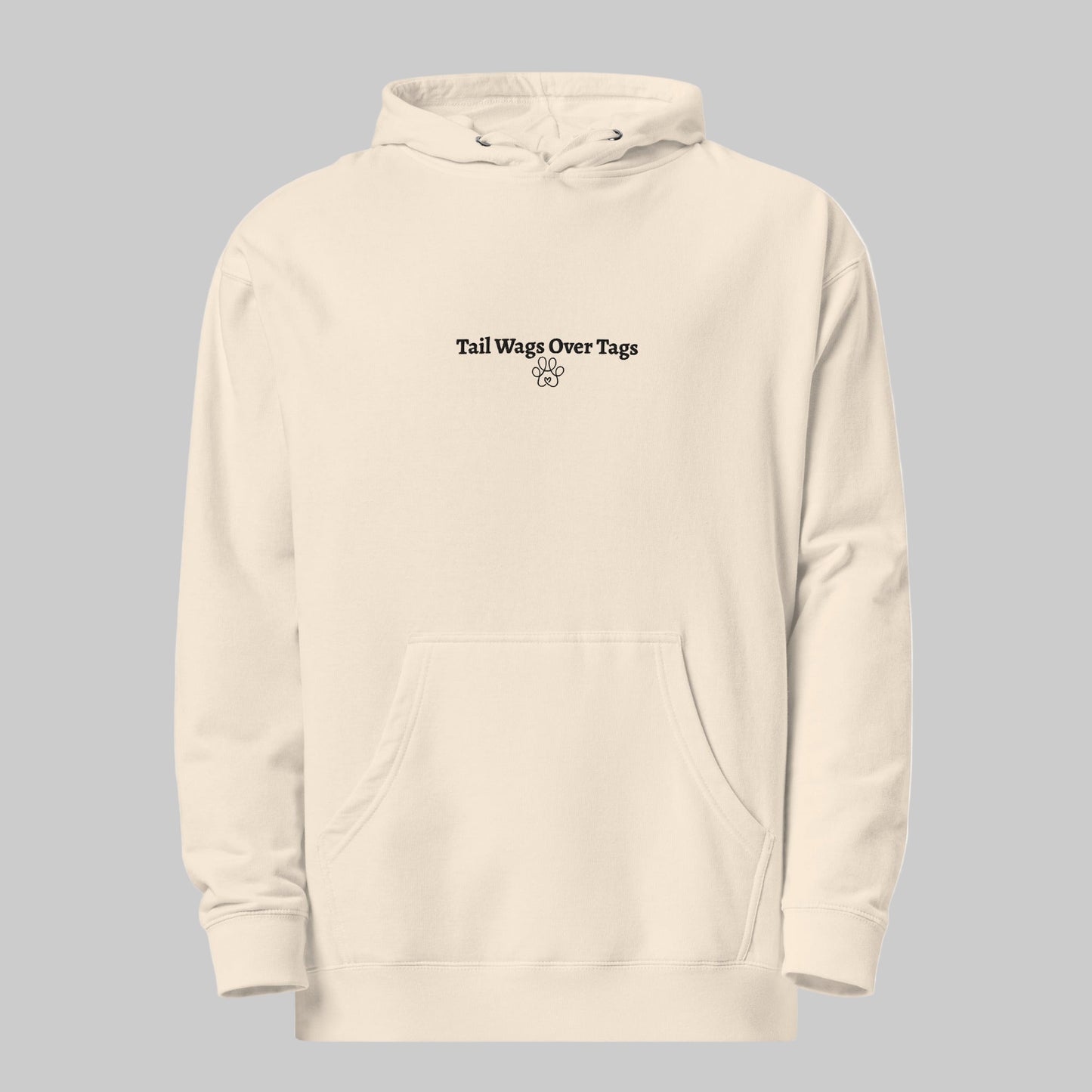 Beige hoodie with text 'Tail Wags Over Tags' on a white background