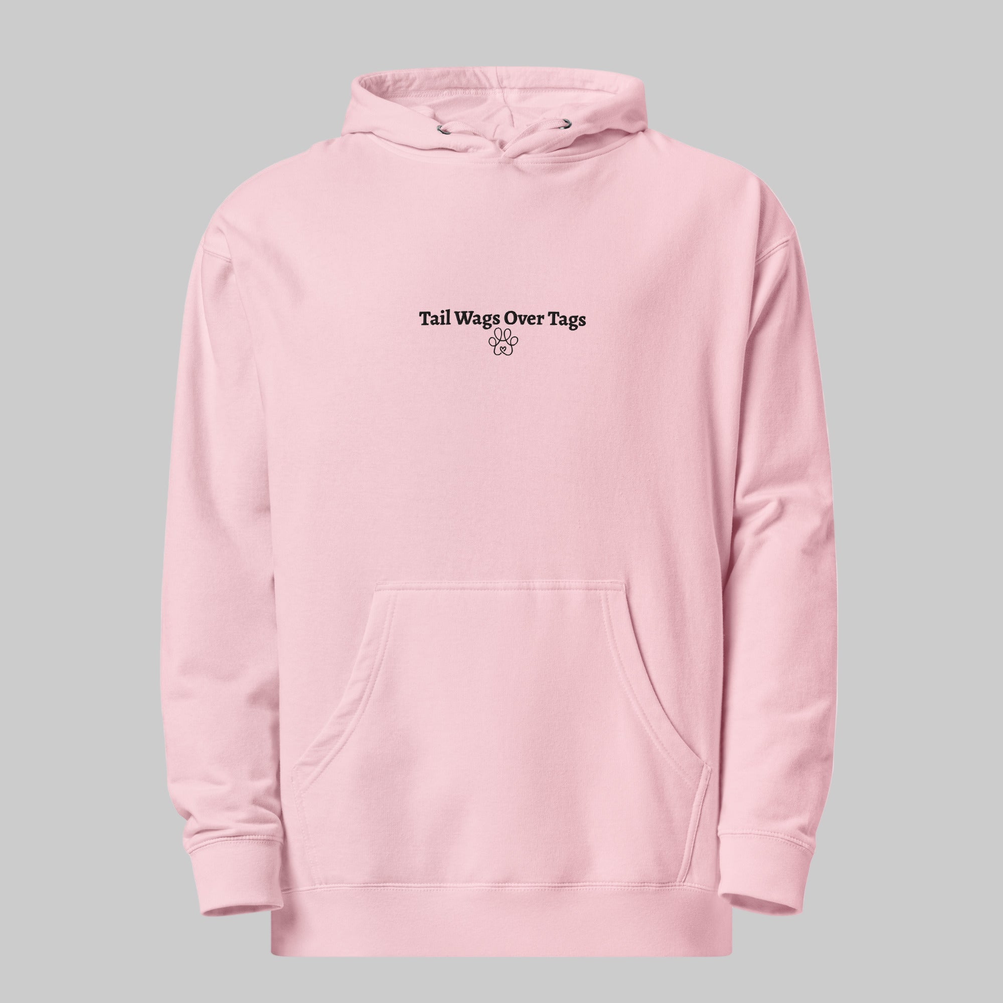 Pink hoodie with text 'Tail Wags Over Tags' on a gray background