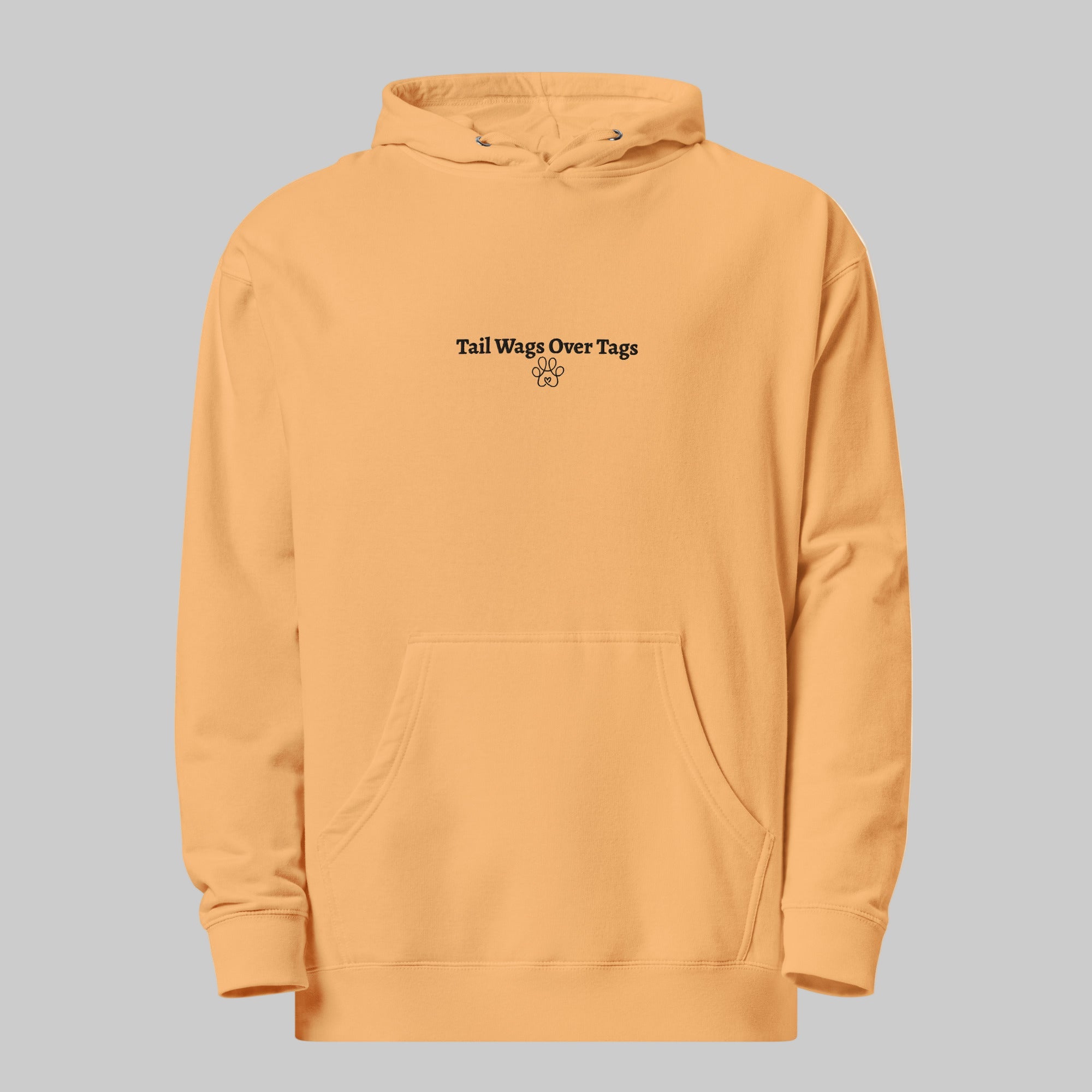 Mustard yellow hoodie with text on a gray background
