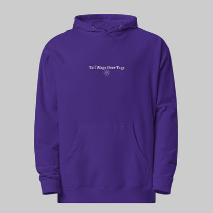 Purple hoodie with text 'Tail Wags Over Tags' on a white background