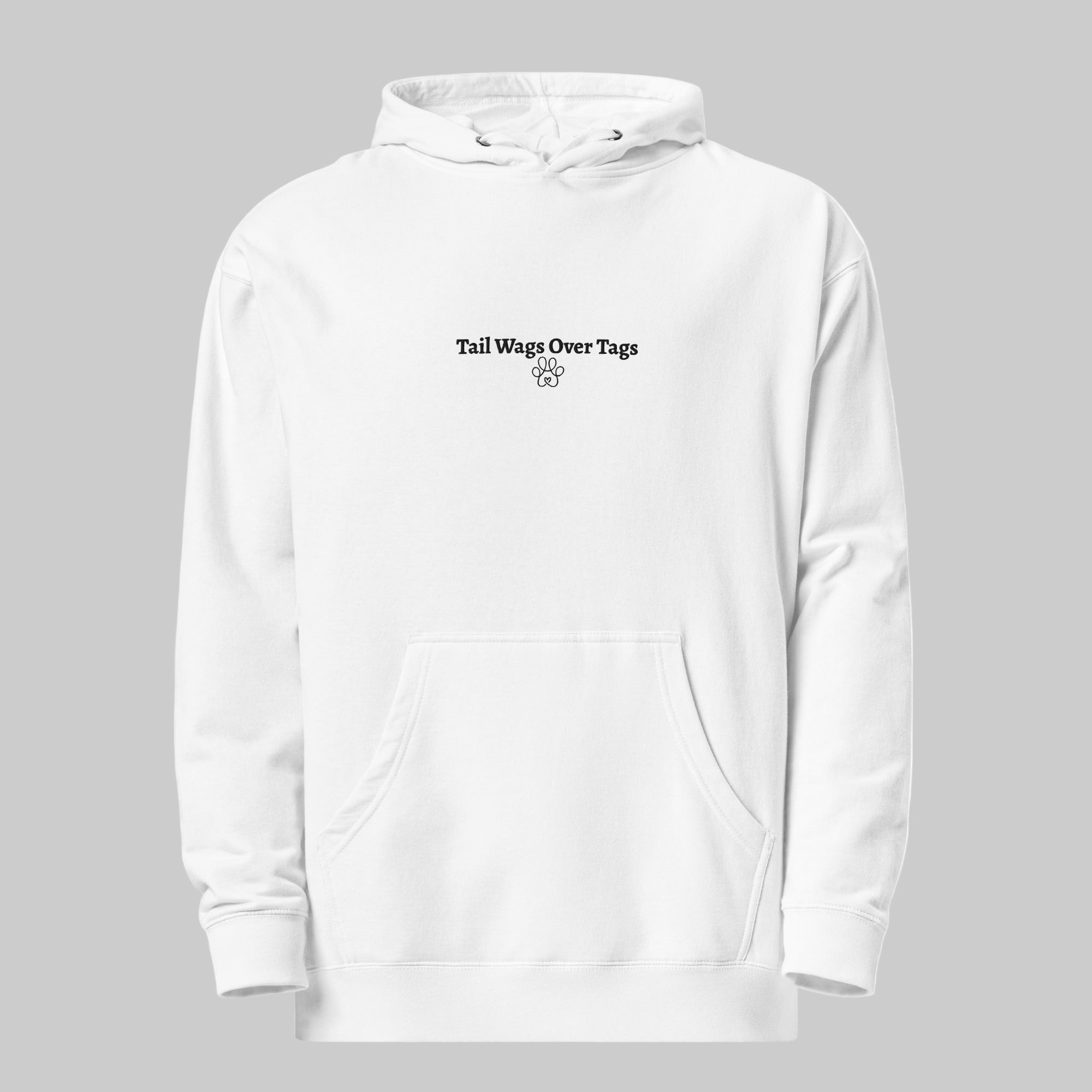 White hoodie with text 'Tail Wags Over Tags' on a gray background